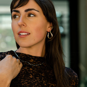 Young Woman Dressed Casually Chic Wearing Silver Necklace and Earrings from What If You Stayed Jewelry